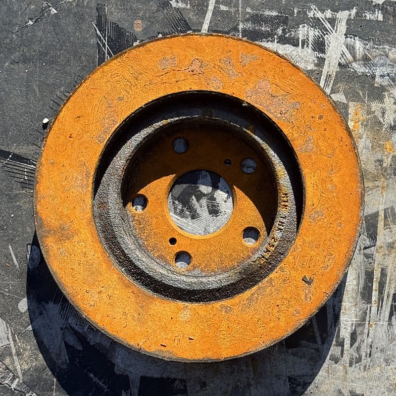 Brake rotor before laser cleaning, covered in rust