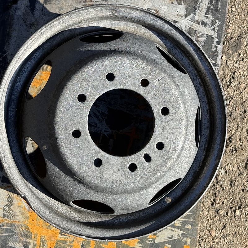 8-lug steel truck wheel after laser rust removal, bare metal